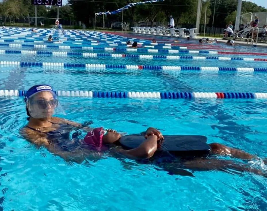 a couple of women in a pool
