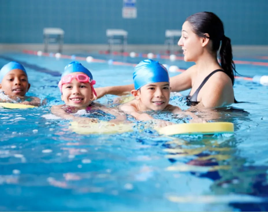 a group of children in a pool