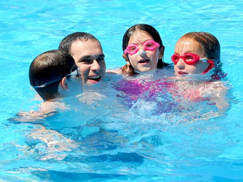 a group of people in a pool