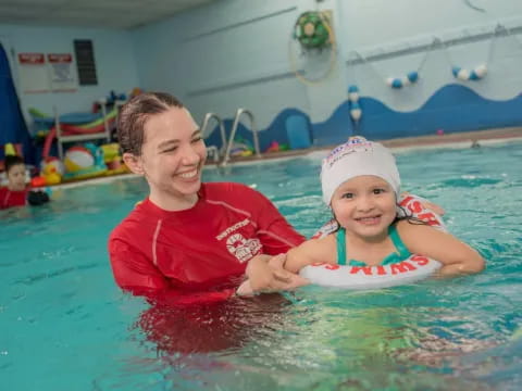 a person and a child in a pool