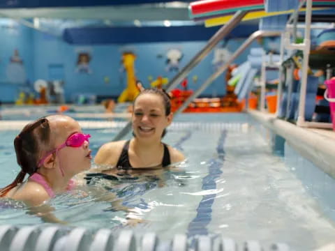 a couple of women in a pool