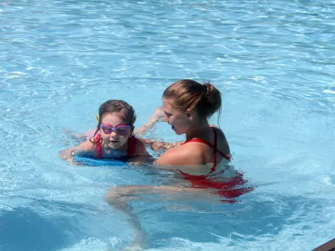 a group of girls in a pool