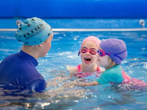 a group of kids in a pool
