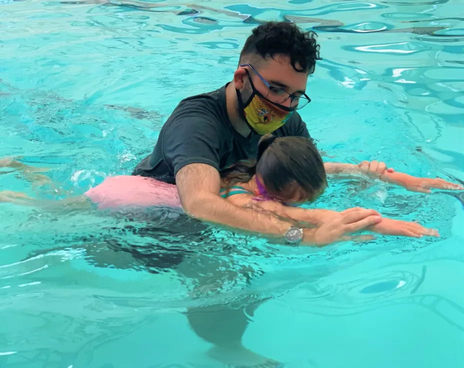a man and a woman in a pool