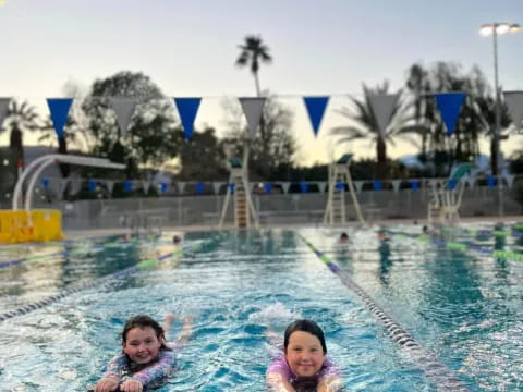 a couple of women in a pool