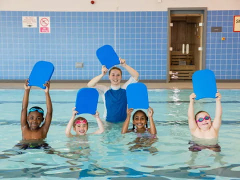 a group of kids in a pool