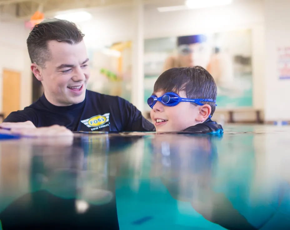 a man and a boy in a pool