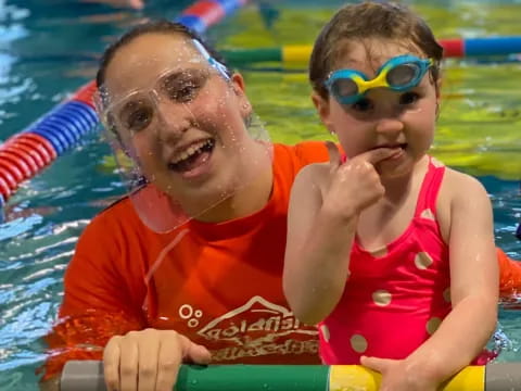 a man and a woman in a pool