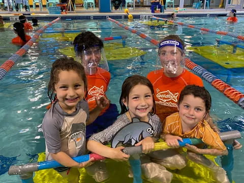 a group of kids in a pool
