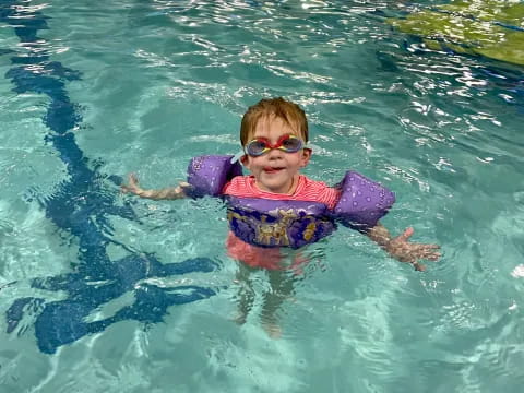 a child in a pool