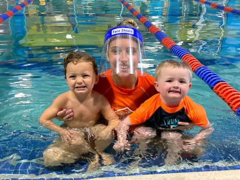 a group of kids in a pool