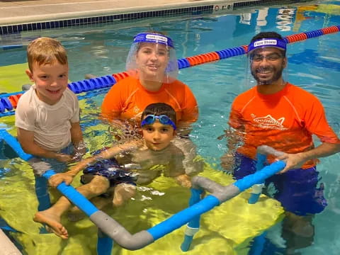 a group of people in a pool