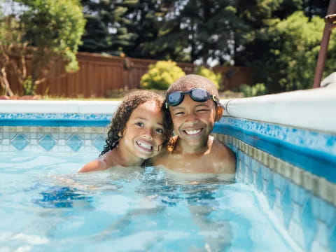 a man and woman in a pool