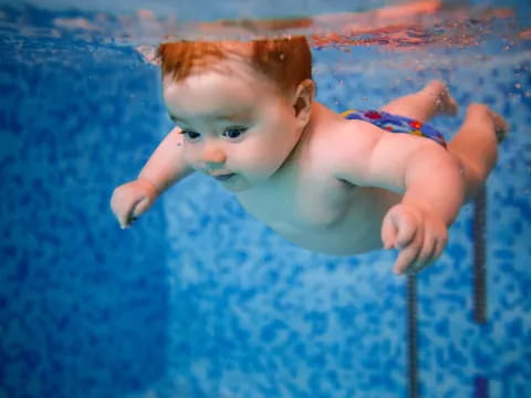 a baby in a pool