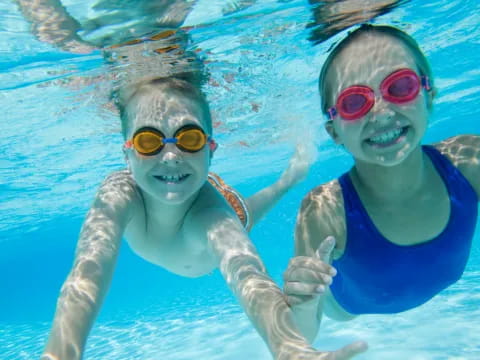 a couple of people in a pool
