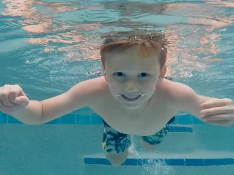 a boy in a pool