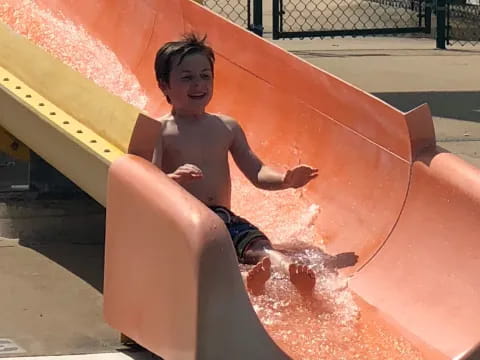 a boy in a pool