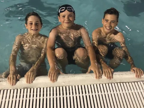 a group of boys in a pool