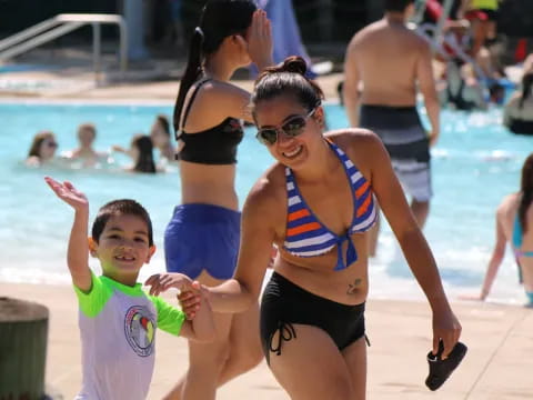 a person and a boy in a pool