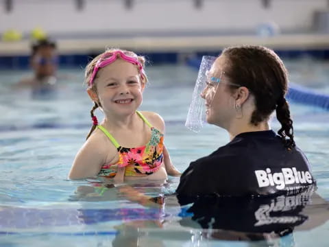 a person and a child in a pool