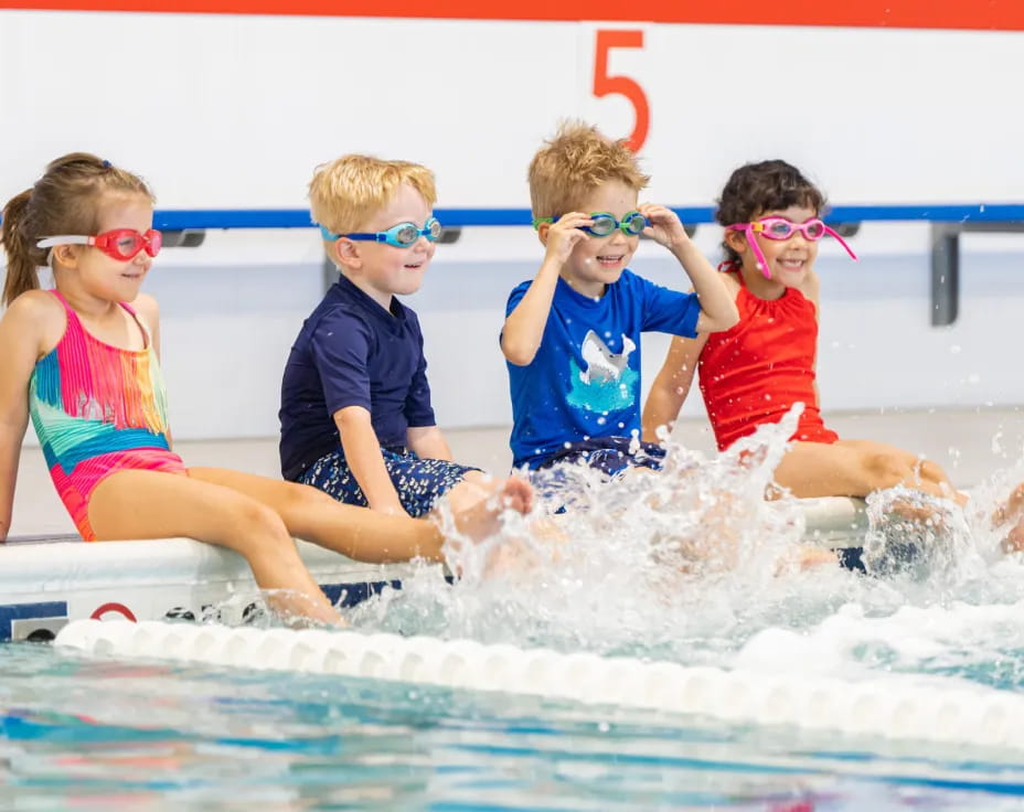 a group of kids in a pool