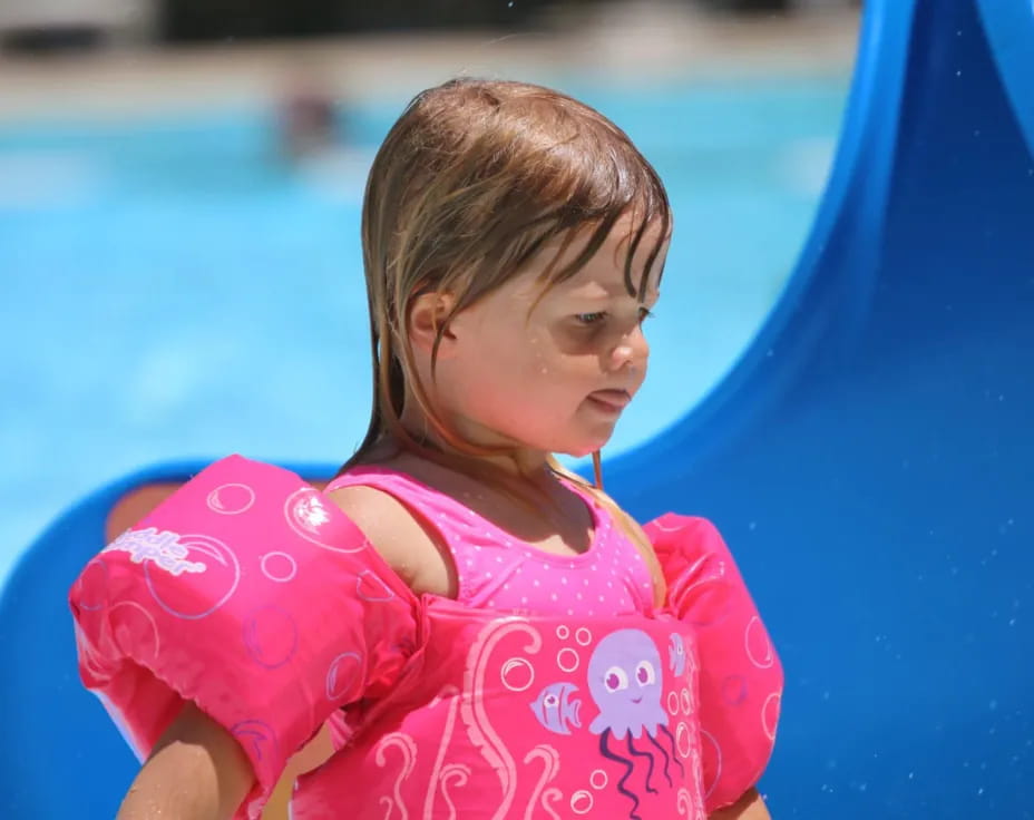 a baby in a pool
