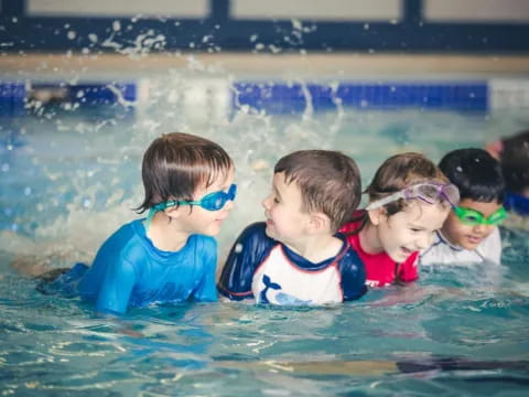a group of children in a pool
