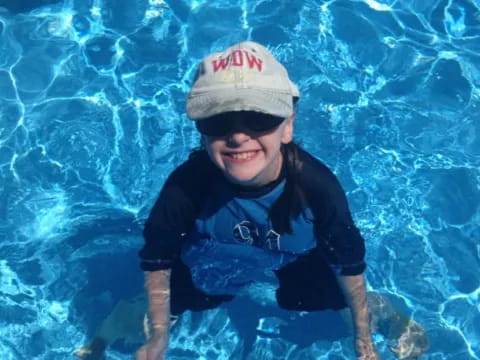 a boy in a pool