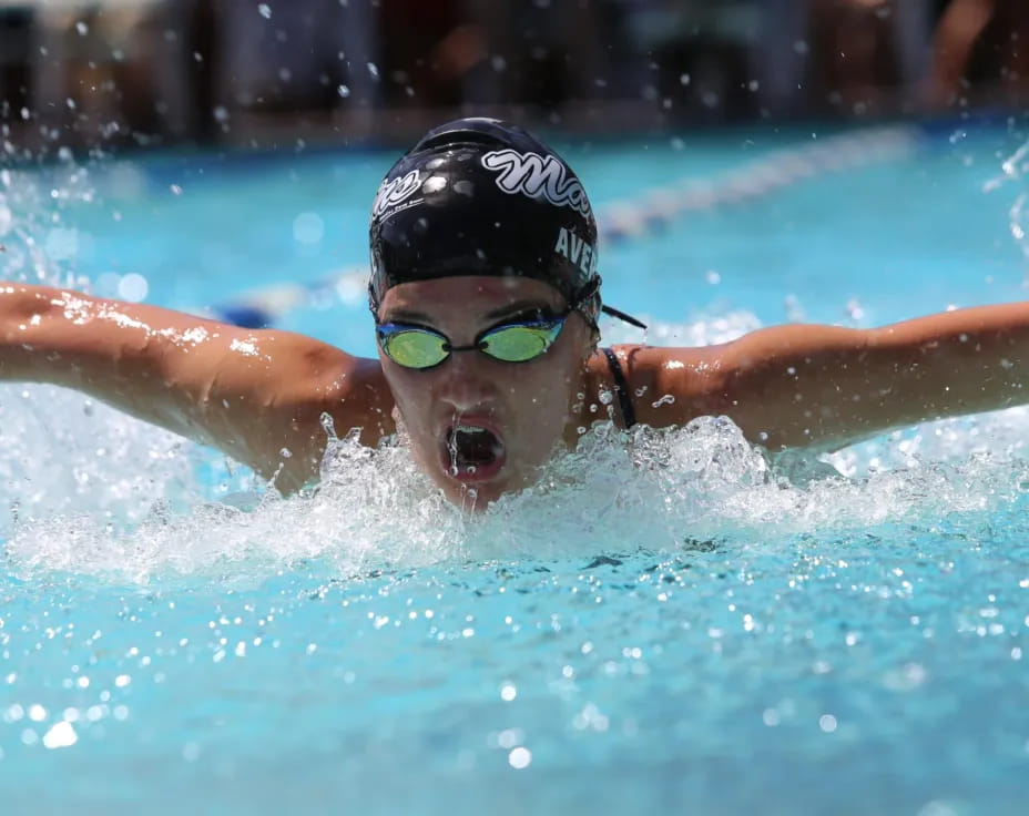 a person swimming in a pool