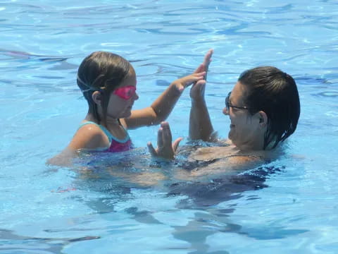 a man and a woman in a pool
