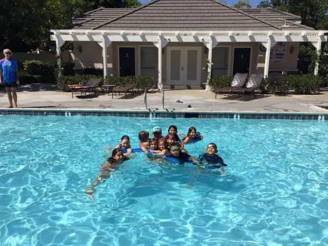 a group of people in a pool