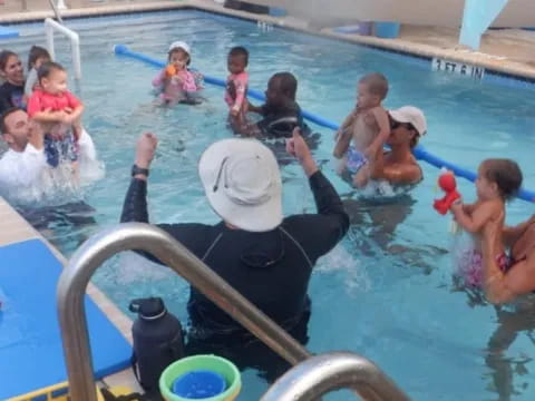 a group of people in a pool