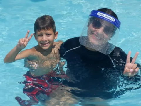 a man and a boy in a pool