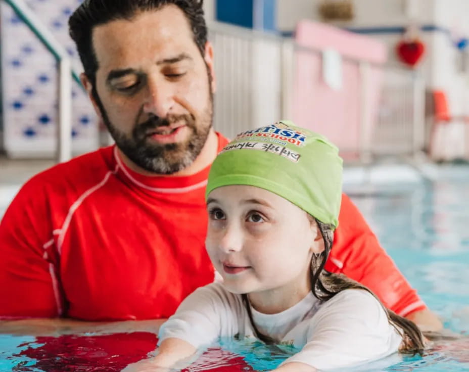 a man and a woman in a pool