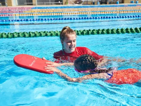 a man and a boy in a pool