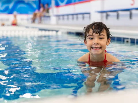 a boy in a pool