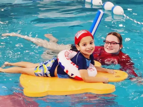 a person and a child in a pool