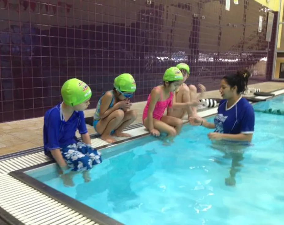 a group of kids in a pool