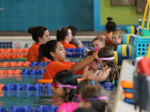 a group of children in a pool