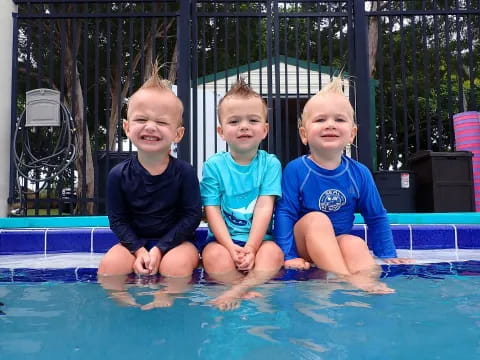 a group of children in a pool