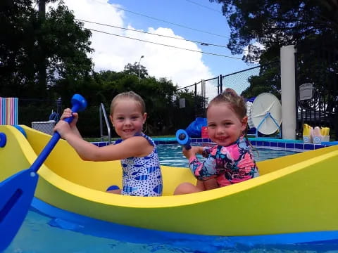 two kids in a pool
