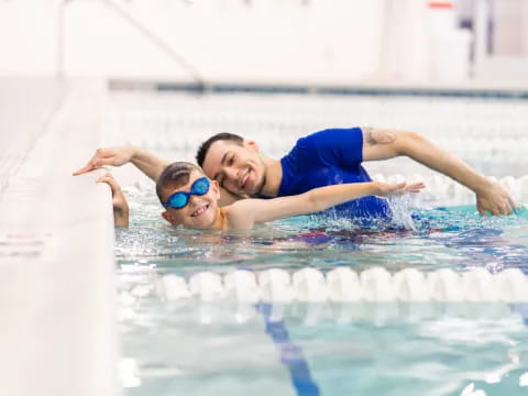 a man and woman in a pool