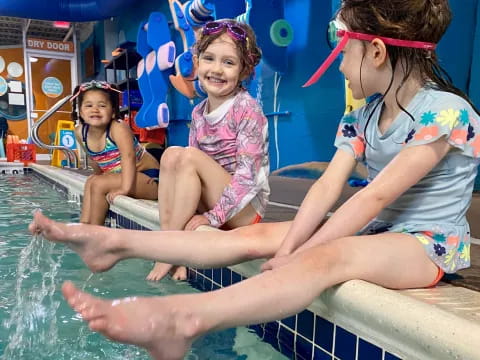a person and a child in a pool