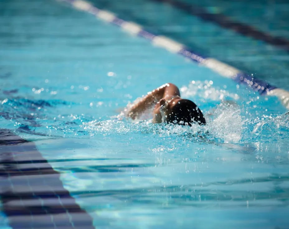 a person swimming in a pool