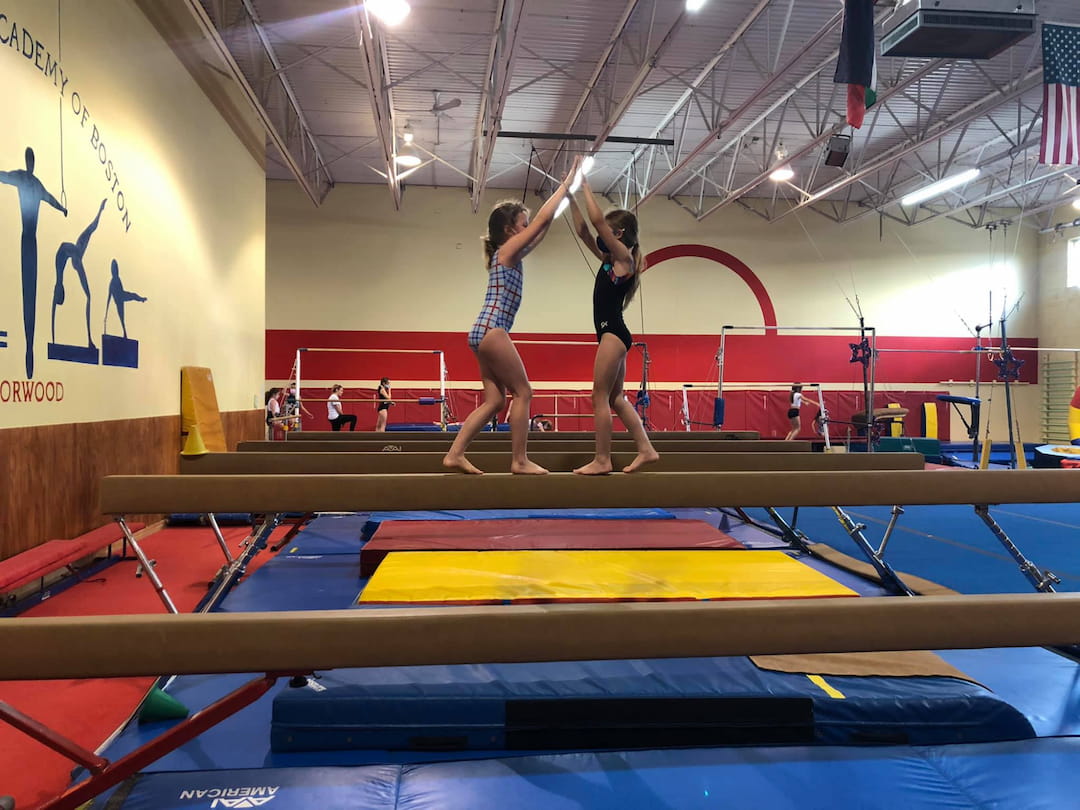 a couple of women on a mat