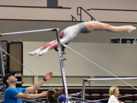 a person jumping over a bar