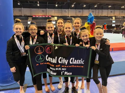 a group of women holding a sign