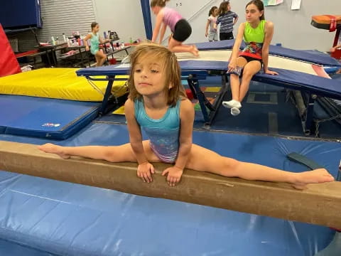 a girl sitting on a trampoline