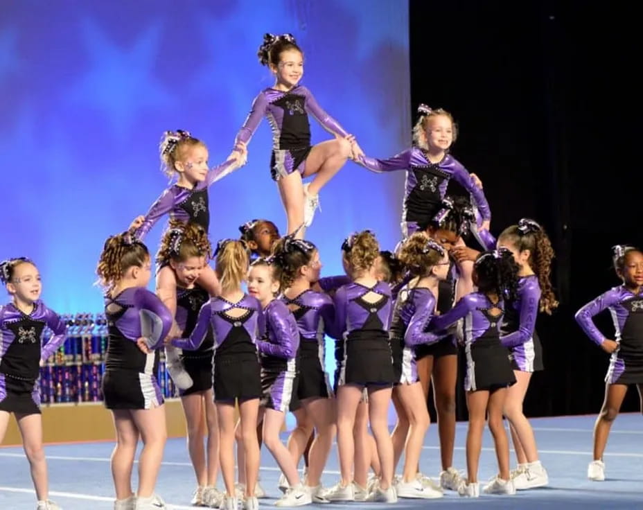 a group of girls in purple uniforms