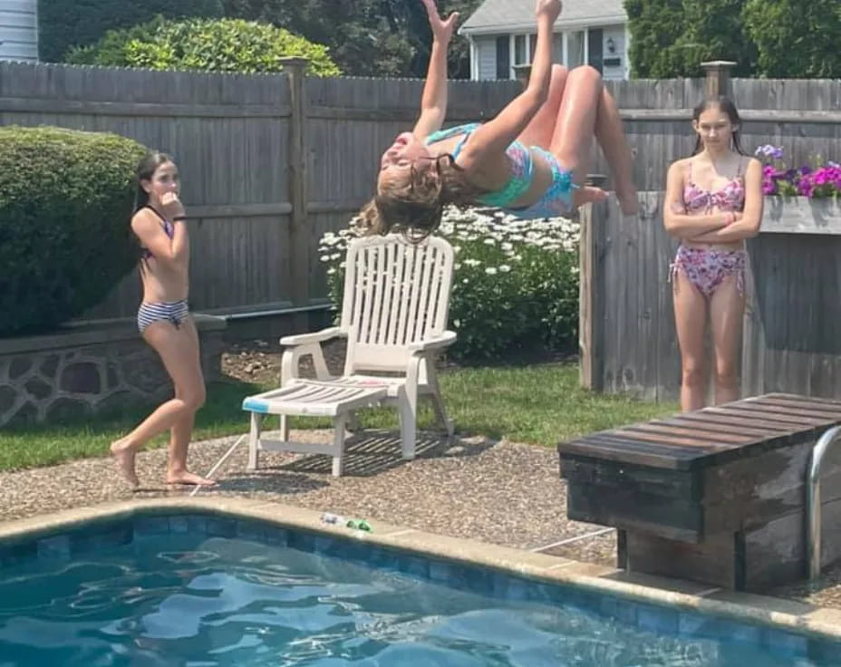 a person jumping into a pool